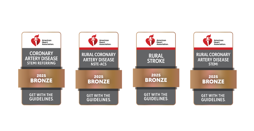 Four award banners displaying organizational recognition badges from the American Heart Association and American Stroke Association.